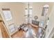 A living room with a fireplace and tall windows as viewed from an above hallway at 4213 Bretdale Nw Run, Kennesaw, GA 30152
