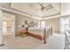 Spacious main bedroom featuring a trey ceiling and large bed frame at 4213 Bretdale Nw Run, Kennesaw, GA 30152