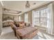 Sitting area featuring an upholstered chaise lounge, trey ceiling, and bedroom at 4213 Bretdale Nw Run, Kennesaw, GA 30152