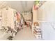 Walk-in closet with storage shelves and rods for hanging clothes at 4213 Bretdale Nw Run, Kennesaw, GA 30152