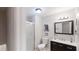 Modern bathroom with glass shower, vanity and marble countertops at 4244 Dorsey Sw Ct, Lilburn, GA 30047