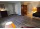 Spacious bedroom with gray wood flooring, two closets, and plenty of natural light at 4244 Dorsey Sw Ct, Lilburn, GA 30047