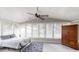 Sun-filled bedroom featuring expansive windows, neutral decor, and ample space for relaxation and personal touches at 4244 Dorsey Sw Ct, Lilburn, GA 30047