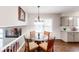 A bright dining area adjacent to the kitchen with a round table offers a cozy space for meals and entertaining at 4244 Dorsey Sw Ct, Lilburn, GA 30047