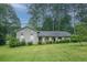 Charming brick home featuring a well-manicured lawn and lovely landscaping that enhances its curb appeal at 4244 Dorsey Sw Ct, Lilburn, GA 30047