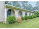 A brick home shows off its unique architectural style with a series of elegant archways and tidy landscaping at 4244 Dorsey Sw Ct, Lilburn, GA 30047