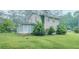Brick home with green grass, fenced in yard, and screened in back porch at 4244 Dorsey Sw Ct, Lilburn, GA 30047