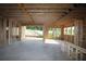 Unfinished basement with exposed wood framing, concrete floor, and natural light from the yard at 4740 Briscoe Drive, Cumming, GA 30028
