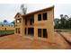 Exterior view of a home under construction, showcasing the wood framing and window openings at 4740 Briscoe Drive, Cumming, GA 30028