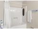 This bathroom has a shower and bathtub combo with a white shower curtain at 5006 Dantel Way, Stone Mountain, GA 30083