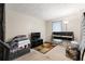 Bedroom features a window, area rug, TV and entertainment stand at 5006 Dantel Way, Stone Mountain, GA 30083