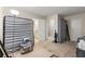 Bedroom features a window, cleaning supplies, and door leading to the bathroom at 5006 Dantel Way, Stone Mountain, GA 30083