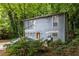 Charming two-story home with a covered car and landscaped yard at 5006 Dantel Way, Stone Mountain, GA 30083