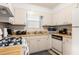 Functional kitchen featuring essential appliances and bright countertops, offering a practical cooking space at 5006 Dantel Way, Stone Mountain, GA 30083
