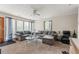 Spacious living room featuring plush sofas, a glass coffee table, and natural light streaming through the windows at 5006 Dantel Way, Stone Mountain, GA 30083