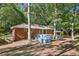 The home has a backyard with a small above ground pool and patio, set among mature trees at 5222 Skyline Dr, Stone Mountain, GA 30083
