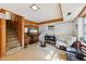 Finished basement with wood paneled accents, open staircase and recreation area at 5222 Skyline Dr, Stone Mountain, GA 30083