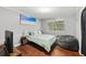 Comfortable bedroom featuring hardwood floors, gray walls and a comfortable beanbag chair at 5222 Skyline Dr, Stone Mountain, GA 30083