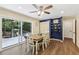 Bright dining area with backyard views, open shelving and access to outdoor patio at 5222 Skyline Dr, Stone Mountain, GA 30083