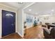 View of the home's front door with the living room in the background featuring hardwood floors at 5222 Skyline Dr, Stone Mountain, GA 30083