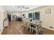 Open kitchen featuring stainless steel appliances, two-tone cabinets, and dining area with wooded views at 5222 Skyline Dr, Stone Mountain, GA 30083