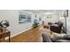 Cozy living room featuring hardwood floors, a large window, and comfortable leather furniture at 5222 Skyline Dr, Stone Mountain, GA 30083