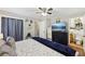Bedroom featuring hardwood floors, ceiling fan and decor accents. Adjoining en-suite bath at 5222 Skyline Dr, Stone Mountain, GA 30083