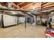 Large unfinished basement space featuring exposed beams, concrete floor, and utility access at 5222 Skyline Dr, Stone Mountain, GA 30083