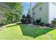 Large grassy backyard with trees, picket fence and house view at 59 Creekside Blf, Hiram, GA 30141