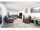 Finished basement featuring a leather sectional, tv, and game table at 59 Creekside Blf, Hiram, GA 30141