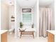 Bright bathroom with a soaking tub, shower curtain, and a window, creating a relaxing spa-like feel at 59 Creekside Blf, Hiram, GA 30141
