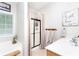 Bright bathroom with a glass door shower, a soaking tub, and a white vanity sink at 59 Creekside Blf, Hiram, GA 30141