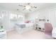 Charming bedroom with storage bed, ceiling fan, and plenty of natural light at 59 Creekside Blf, Hiram, GA 30141