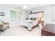 Cozy bedroom with lots of natural light, a comfortable chair, and serene decor at 59 Creekside Blf, Hiram, GA 30141