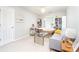 Cozy bedroom with neutral tones, ample natural light and a comfortable seating area at 59 Creekside Blf, Hiram, GA 30141