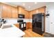 Well-lit kitchen featuring stainless steel appliances, white subway tile backsplash, and wooden cabinets at 59 Creekside Blf, Hiram, GA 30141