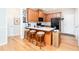 Eat-in kitchen features a breakfast bar, wooden cabinets, and stainless steel appliances at 59 Creekside Blf, Hiram, GA 30141