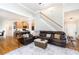Spacious living room featuring hardwood floors, large sectional, and an open floor plan at 59 Creekside Blf, Hiram, GA 30141
