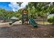 Community playground with a slide and play structure, perfect for outdoor fun at 59 Creekside Blf, Hiram, GA 30141