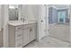 Bright bathroom featuring a modern vanity with white countertop and stylish fixtures at 1409 Bluffs Ridge Way, Canton, GA 30114