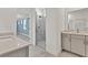 Elegant bathroom with modern vanity, glass shower, and marble-style tiling at 1409 Bluffs Ridge Way, Canton, GA 30114