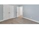 Bedroom closet with double doors and neutral carpeting at 1409 Bluffs Ridge Way, Canton, GA 30114