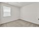 Cozy bedroom with carpet, window, and minimalist interior design at 1409 Bluffs Ridge Way, Canton, GA 30114