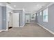 Large bedroom with plush carpeting, gray walls, and access to the outdoors at 1409 Bluffs Ridge Way, Canton, GA 30114