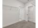 Walk-in closet offering ample storage and organization potential at 1409 Bluffs Ridge Way, Canton, GA 30114