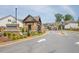 Community entrance with stone features, landscaping, and views of the houses at 1409 Bluffs Ridge Way, Canton, GA 30114