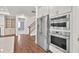 Well-equipped kitchen featuring modern appliances, ample counter space, and custom cabinetry at 1409 Bluffs Ridge Way, Canton, GA 30114