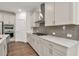 Contemporary kitchen showcasing custom cabinets, tile backsplash, and stainless steel appliances at 1409 Bluffs Ridge Way, Canton, GA 30114