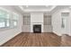 Bright living room with a fireplace, built-in bookshelves, and elegant trim work at 1409 Bluffs Ridge Way, Canton, GA 30114