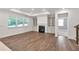 Inviting living area featuring hardwood floors, a fireplace, and built-in cabinets at 1409 Bluffs Ridge Way, Canton, GA 30114